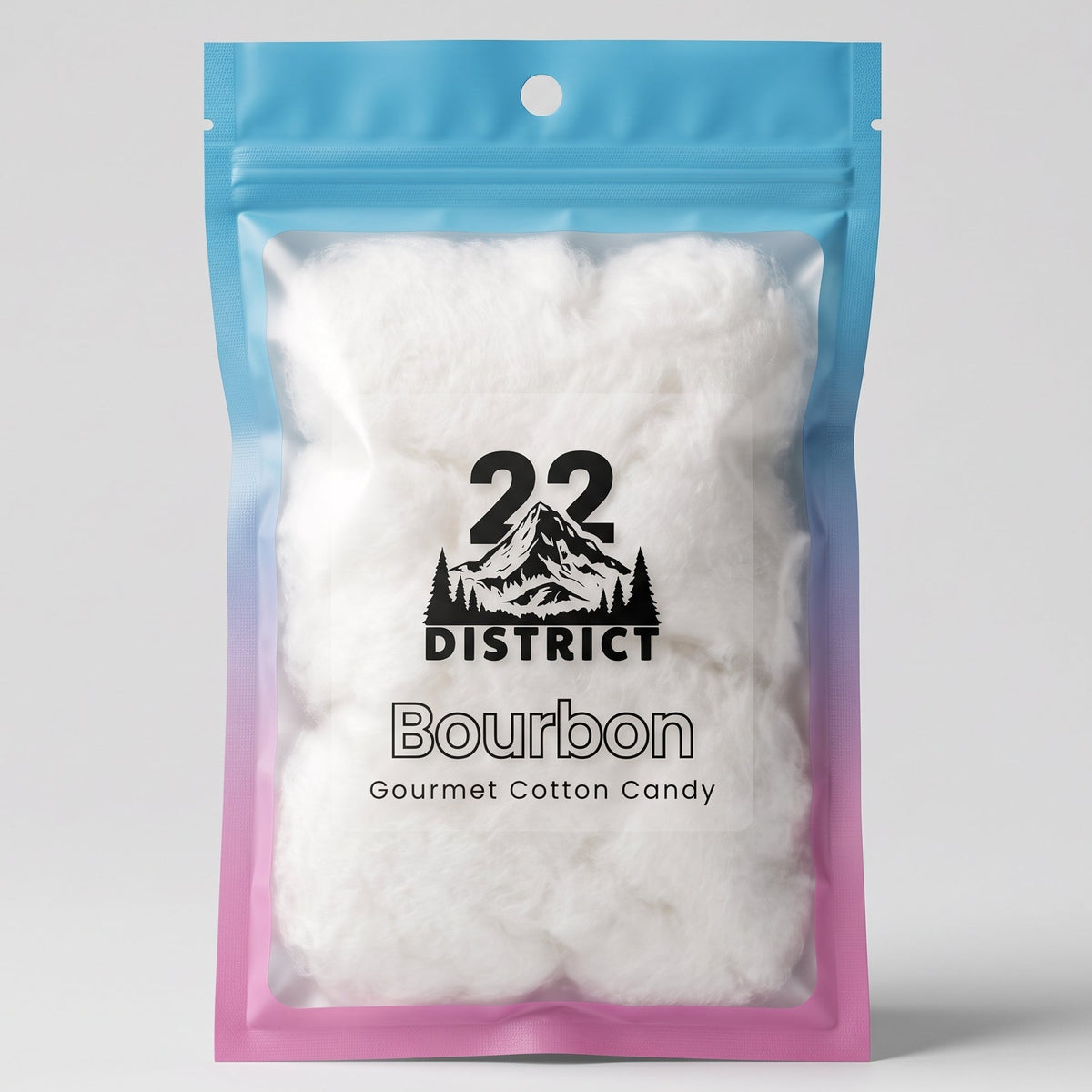 A stand-up resealable pouch of Cloud Candy Co  Bourbon Gourmet Cotton Candy, filled with fluffy white cotton pieces. The pouch has a blue-to-pink gradient design with a black logo and text on the front, set against a neutral light gray background.
